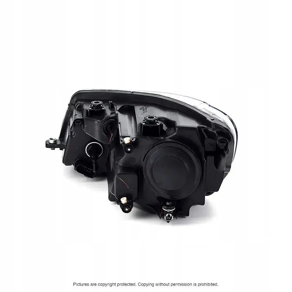 Headlights Vw Caddy 04-10 H4 vist fra baksiden med skruefester og elektriske koblingspunkter.