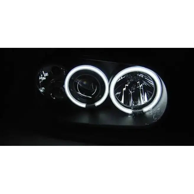 Hovedlys Vw Golf 4 Angel Eyes CCFL Black med to sirkelformede hvite LED-lys i mørk bakgrunn.