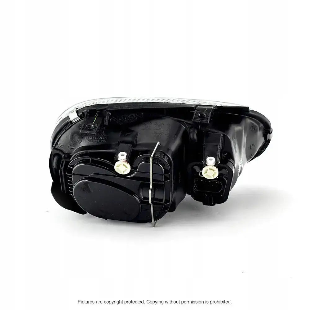 Headlamp bakside av svart frontlykt til VW Golf 4 97-06 med synlige koblingspunkter og festeklips.