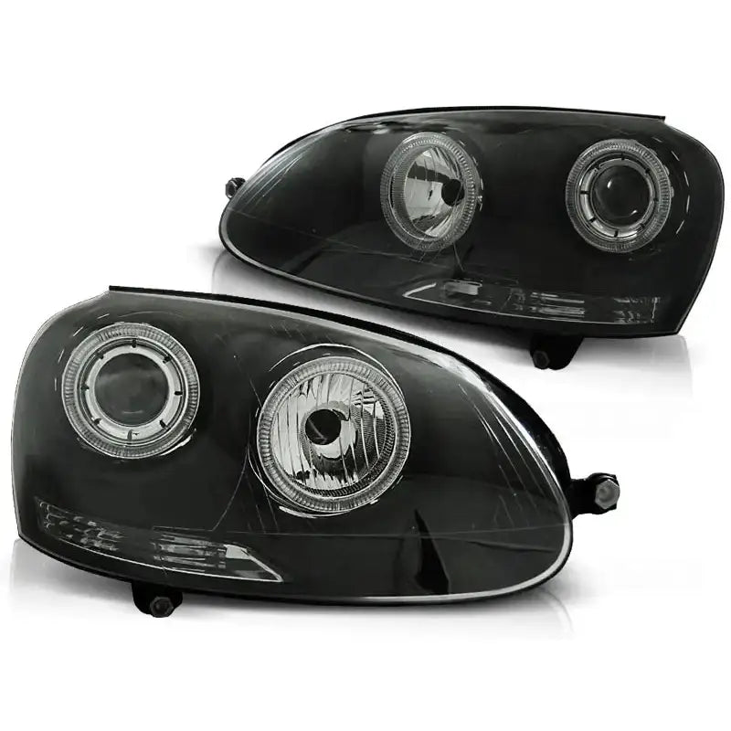 Hovedlykter Vw Golf 5 Angel Eyes Black, svarte med klare glass sett fra skrå vinkel.