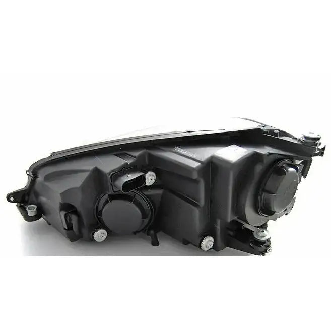 Headlamp bakside av Vw Golf 7 U-Type Black DRL med runde deksler og skruefester synlige.