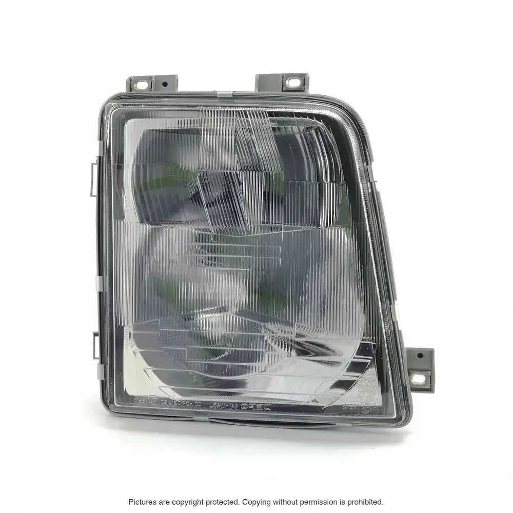 Frontlykter Vw LT 96-06 med rektangulært klart glass, sett forfra med synlige festebraketter og stripemønster.