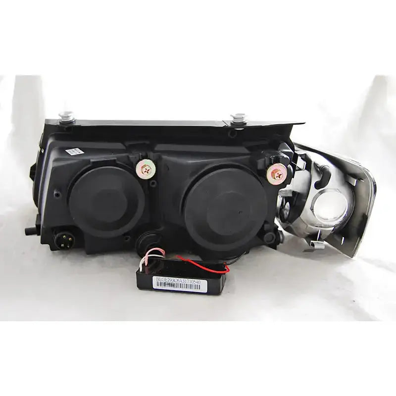 Hovedlys Vw Passat B5 3B halo rims chrome sett bakfra med to runde deksler og synlige skruer.