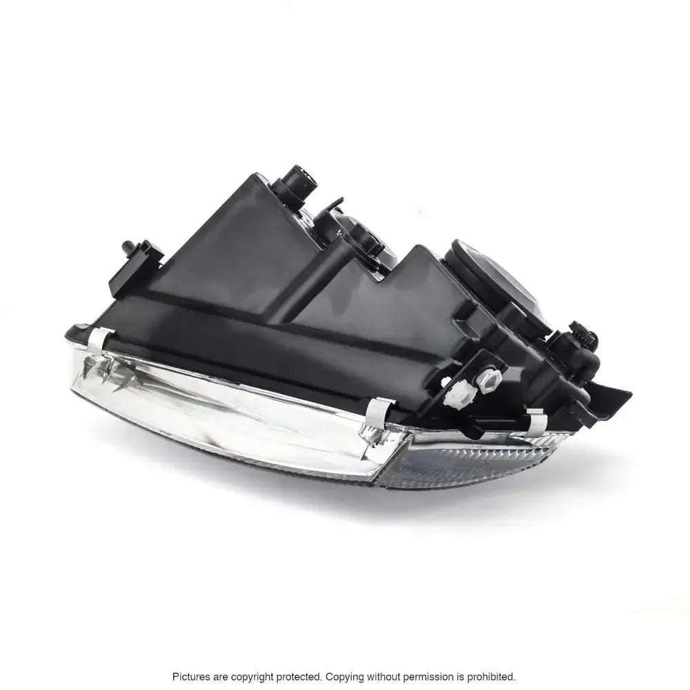 Headlamp Vw Passat B5 97-00 sett fra skrå bakside med synlige monteringspunkter på hvit bakgrunn.