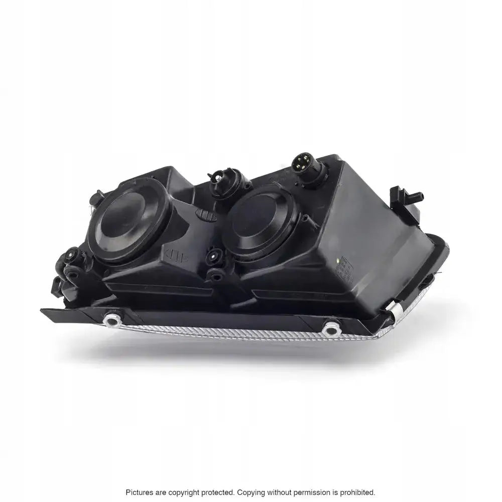 Frontlykter Vw Passat B5 97-00 bakside med runde deksler og monteringspunkter mot hvit bakgrunn.