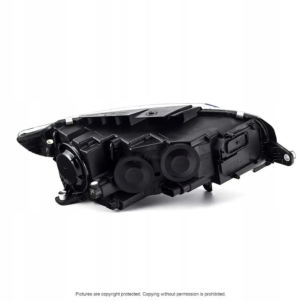 Headlamp bakside av frontlykt til Vw Passat CC 08-12 med synlige deksler og tekniske detaljer.