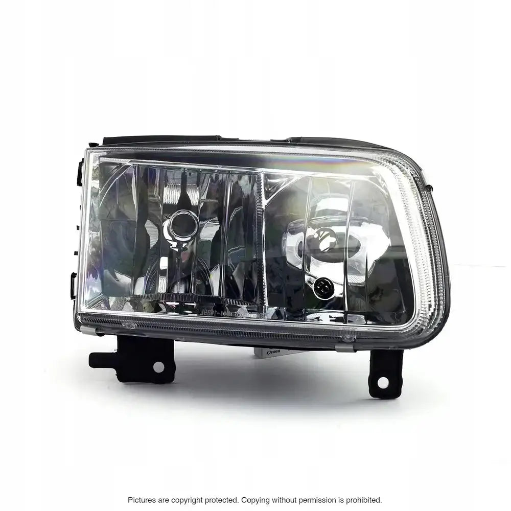 Hovedlykter Vw Polo 6N2 99-01 sett forfra med klar plast, kromdetaljer og synlige reflektorer.