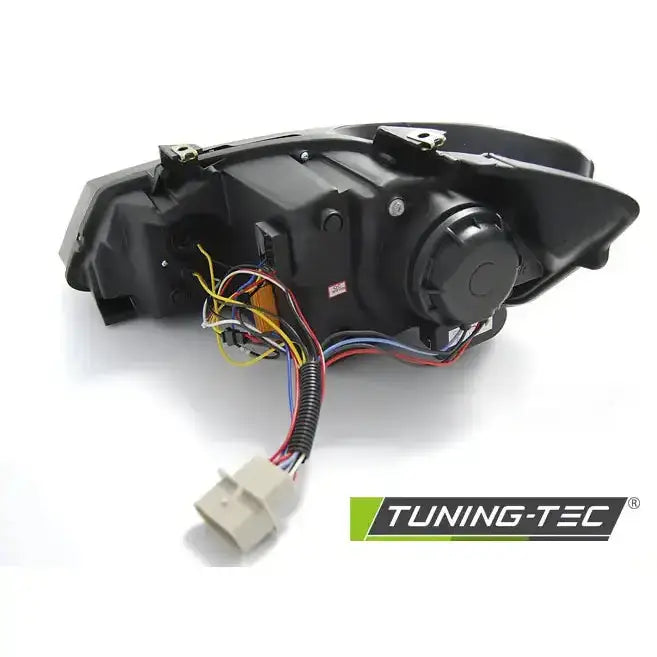 Headlamp bakside av Vw Polo 6R frontlykt med ledninger, kontakter og Tuning-Tec-logo synlig.