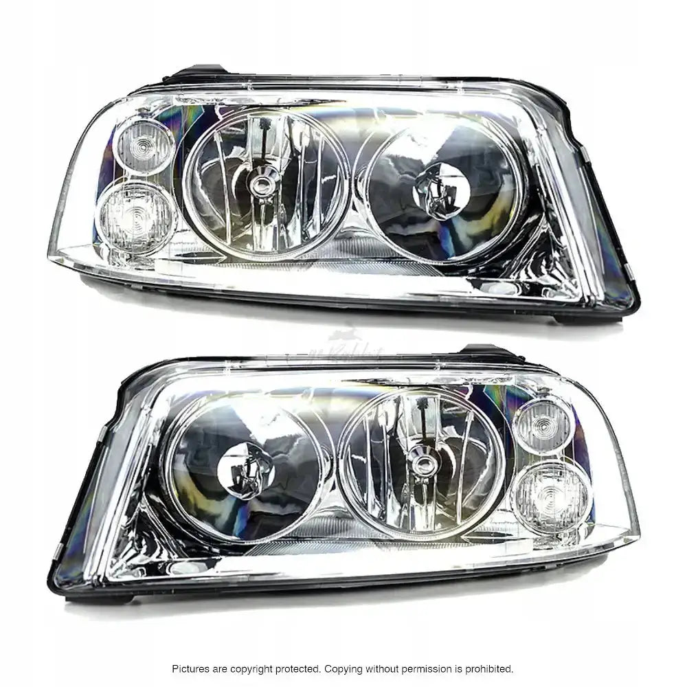 Frontlykter Vw Sharan 04-10 sett forfra med fire runde reflektorer i klar plast mot hvit bakgrunn.