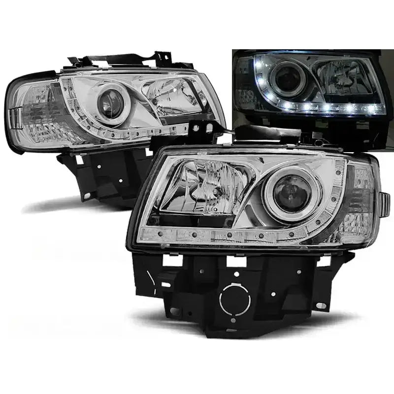 Frontlykter Vw T4 08.96-03.03 BUS Chrome med LED, sett fra skrå front med tent hvitt lys.