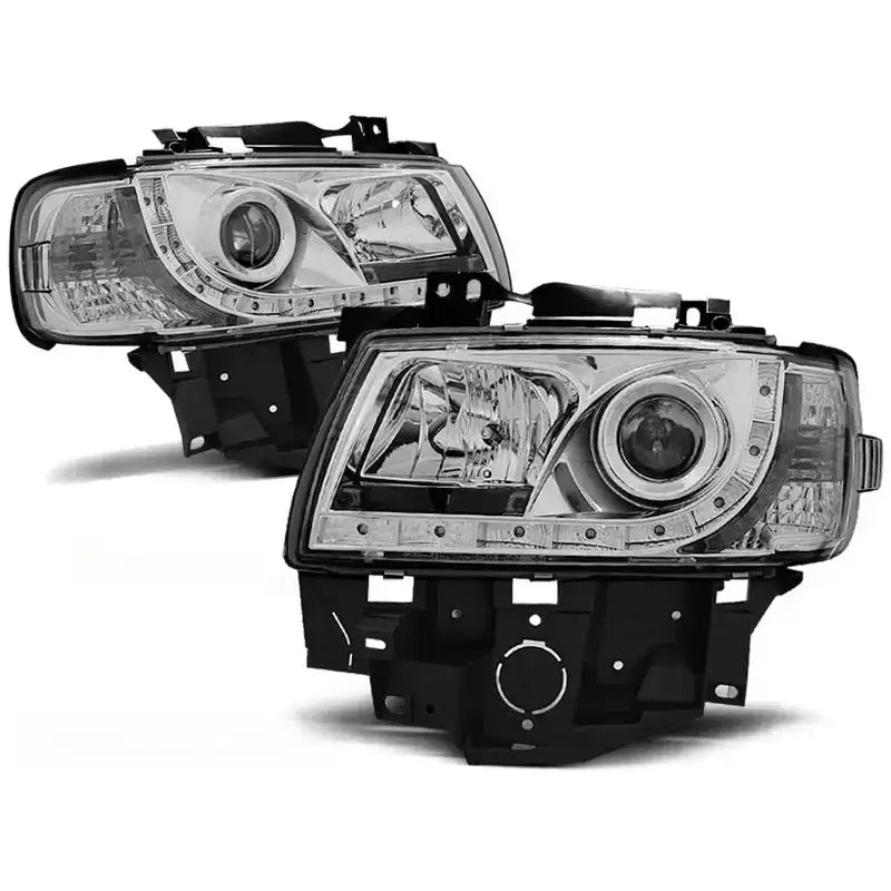 Hovedlykter Vw T4 08.96-03.03 BUS Chrome fra skrå vinkel med LED-detaljer og sorte rammer.