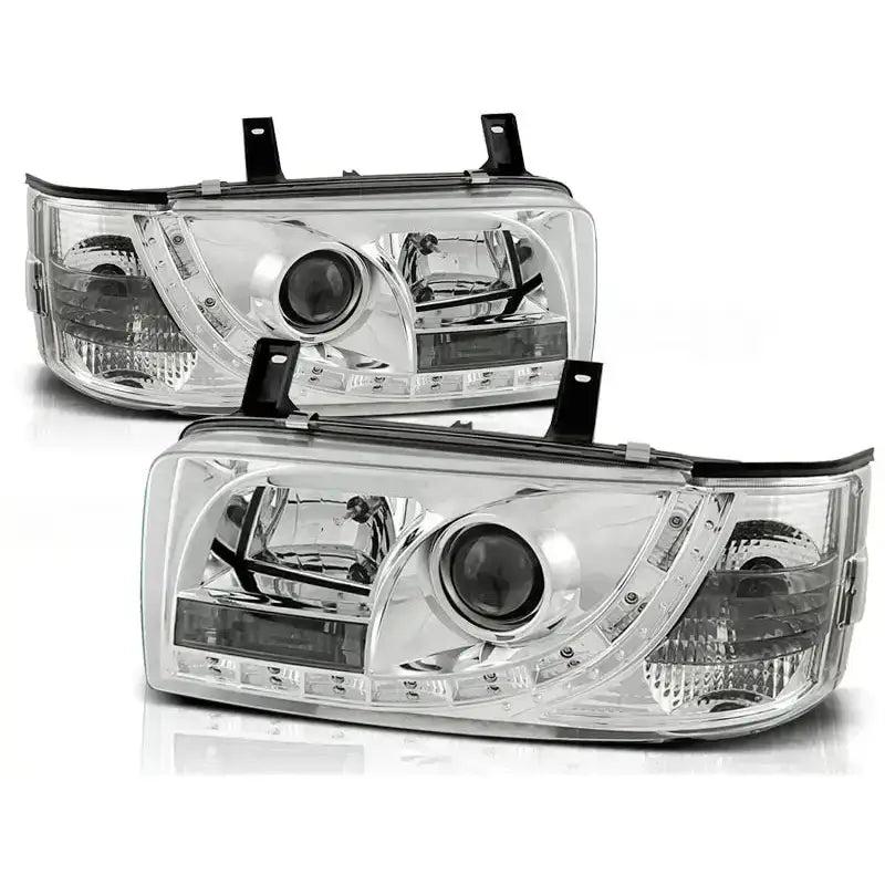 Hovedlykter Vw T4 90-03.03 chrome med runde linser og LED, sett fra skrå vinkel.