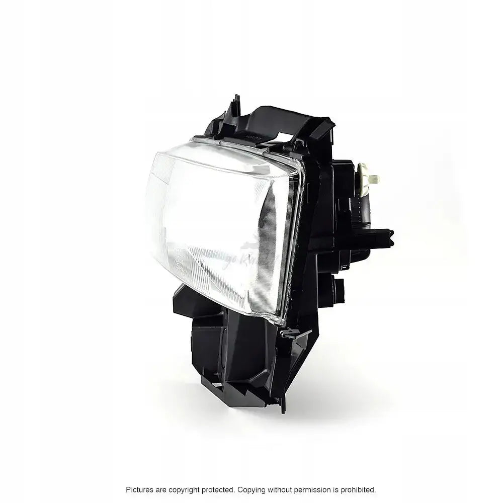 Headlights Vw T4 95-03 rektangulær frontlykt med klart glass og svart hus sett fra høyre side.