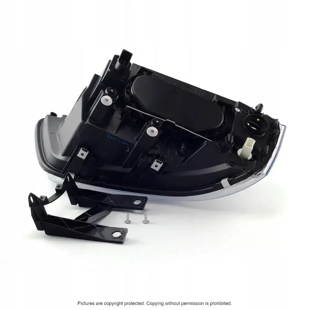 Headlights VW T5 03-09 sett bakfra med monteringsbrakett og skruer på hvit bakgrunn.