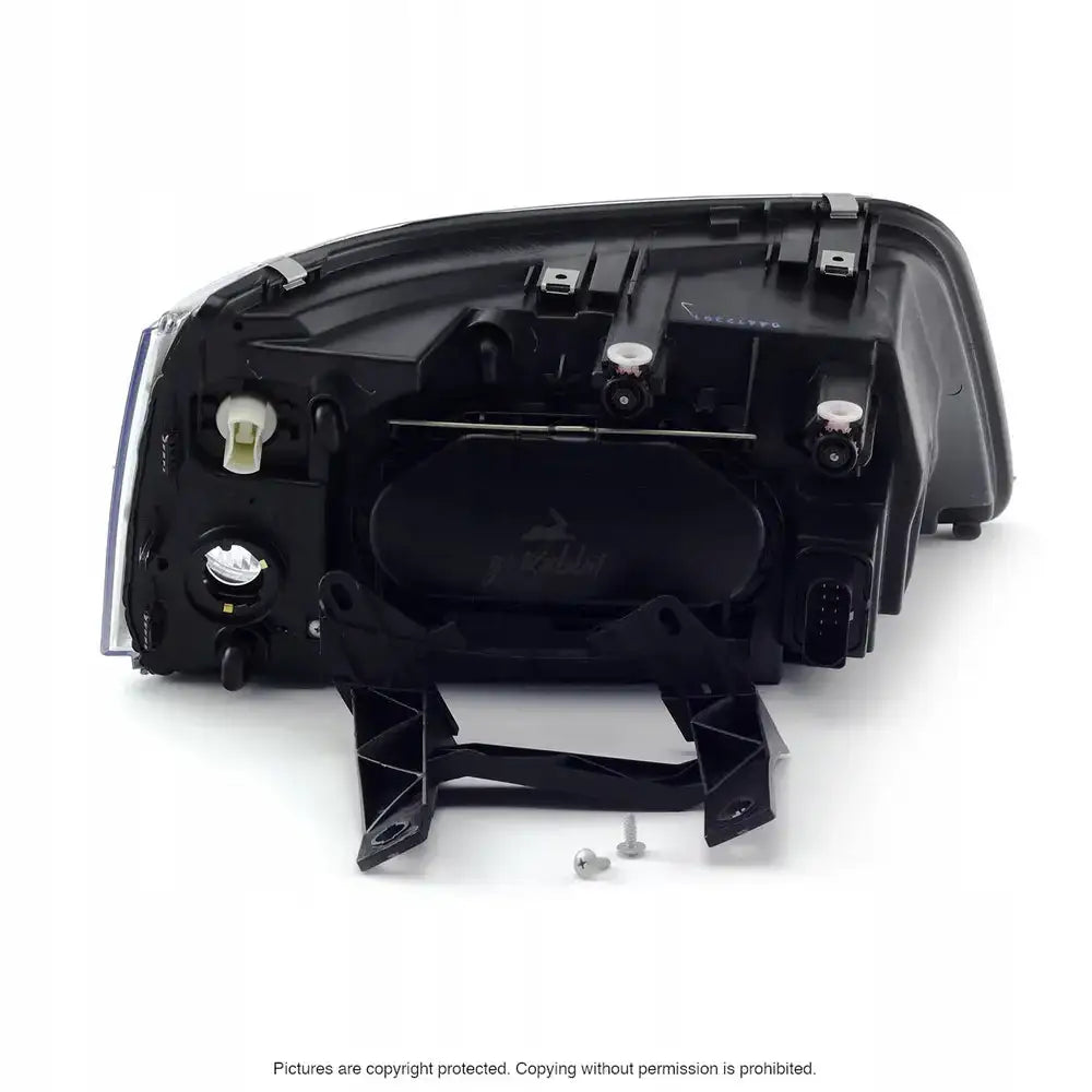 Headlamp bakside av Vw T5 frontlykt 03-09 med synlig koblingspunkt og monteringsbrakett.