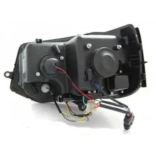 Headlights VW T5 LED Tube Light Black sett bakfra med synlige ledninger, koblinger og runde lokk.