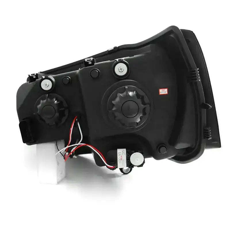 Headlamp Vw T5 U-Type Black sett bakfra med synlige skruer, justeringshjul og ledninger.