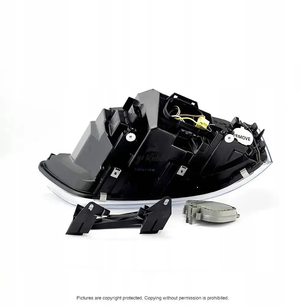 Hovedlykter Vw T5 Transporter 03-09 H4 vist fra siden med monteringsdeler på hvit bakgrunn.