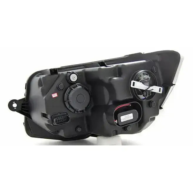 Headlamp til Vw T6 15- bakside med synlige tilkoblinger, lokk og åpninger i svart plast.