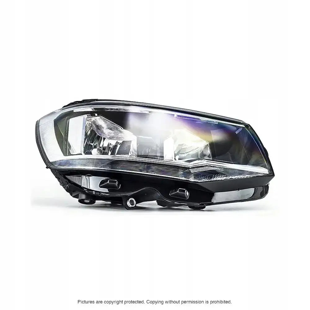 Frontlykter Vw T6 15- H7/H7 i klart glass og svart plast, sett skrått forfra mot hvit bakgrunn.