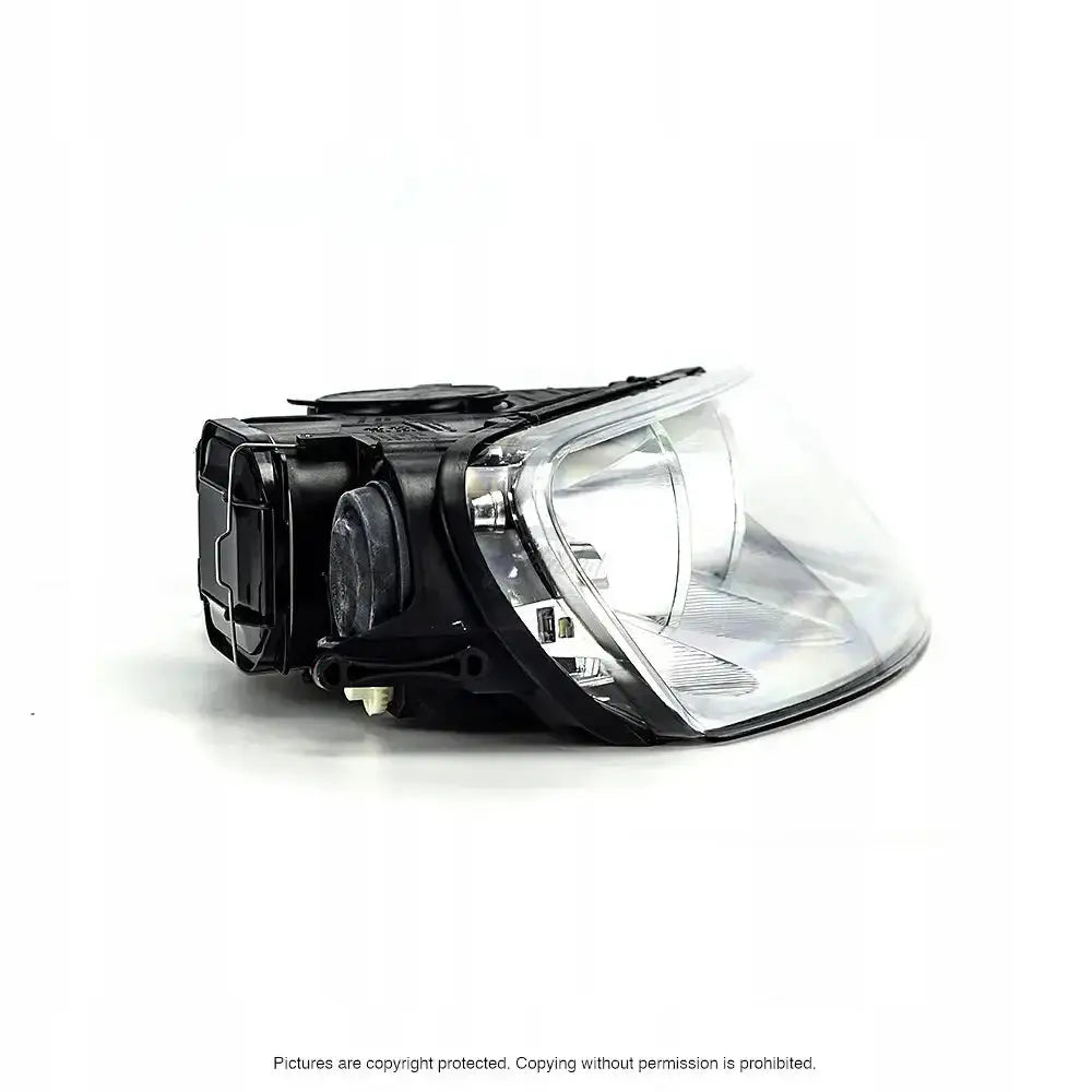 Headlights Vw Touareg 1 02-06 fra skrått sideperspektiv med synlig reflektor og bakside.
