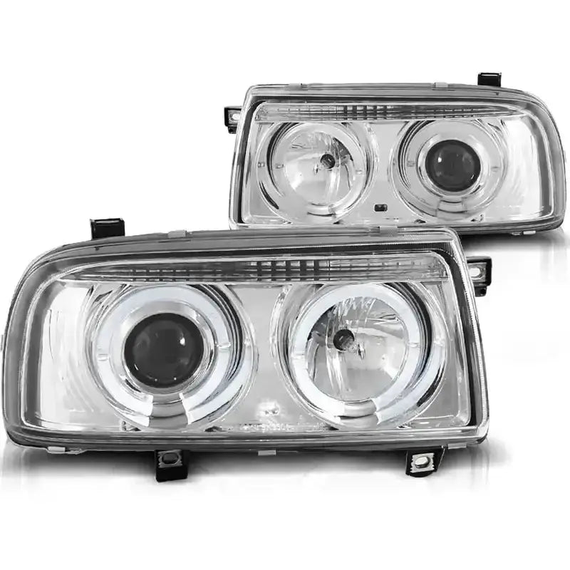 Hovedlykter Vw Vento Angel Eyes Chrome, rektangulære med klart glass og svarte festebraketter, sett forfra.