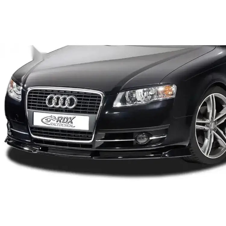 Frontspoiler Audi A4 B7 8H 04-08, sort bil skrått forfra med grill, krom, doble lykter og aluminiumsfelg.