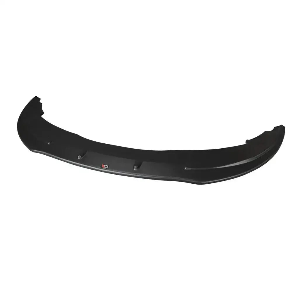 Frontspoiler Audi A6 C6 S-Line Fl sedan sett ovenfra, sort plast med synlig logo mot hvit bakgrunn.