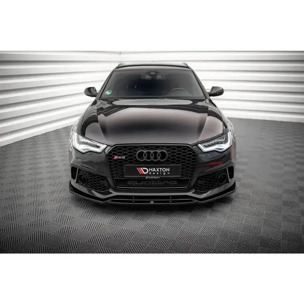 Spoiler på Audi A6 RS6 Look C7, sort bil forfra med markert grill og LED-frontlykter.