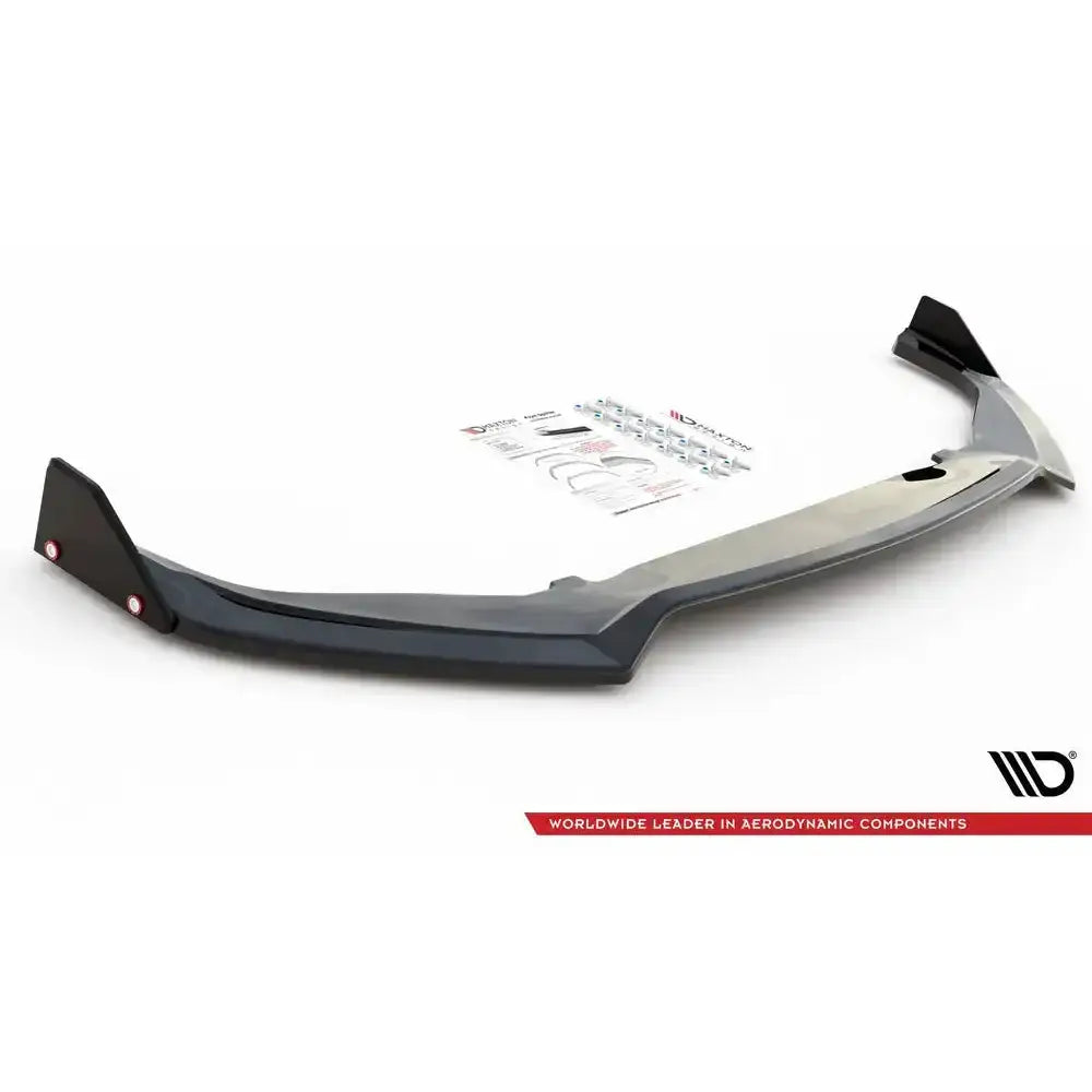 Frontspoiler Toyota GR Yaris Mk4 med flaps V.3 sett fra siden, monteringssett og instruksjoner i bakgrunnen.