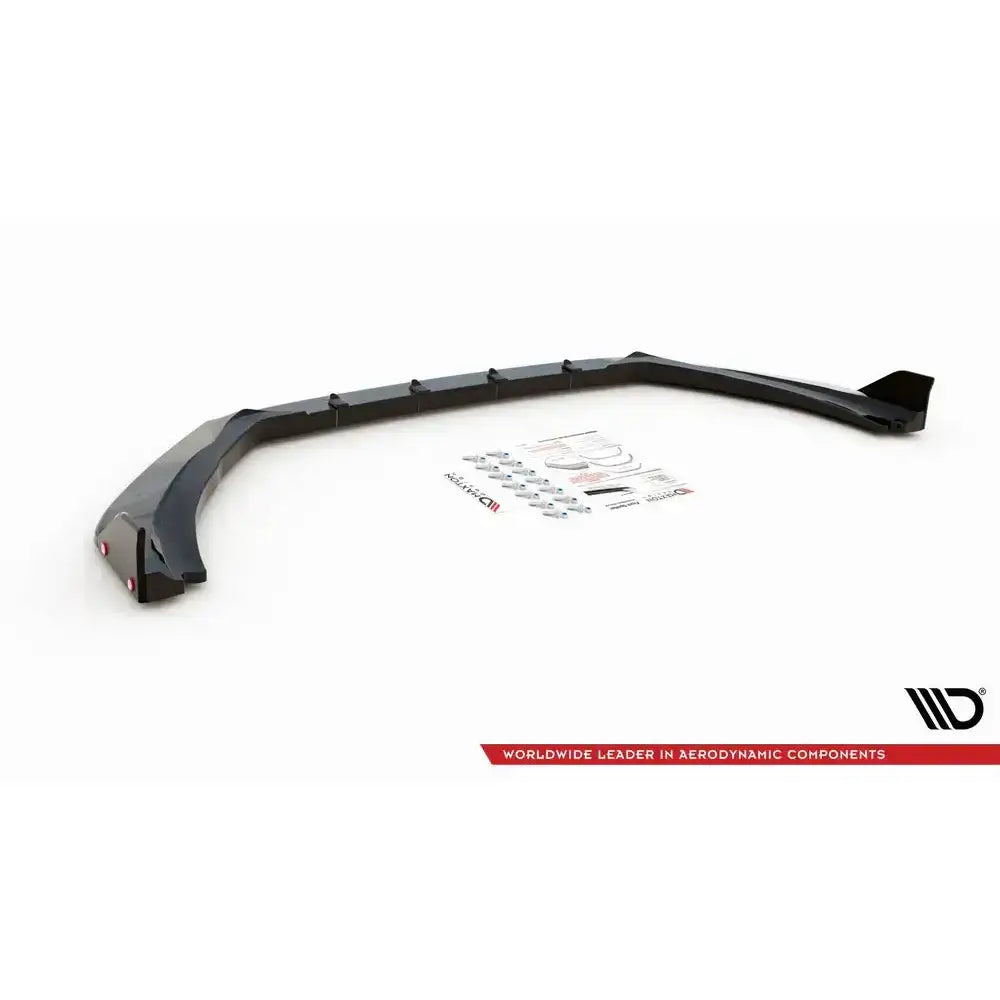 Frontspoiler Ford Fiesta ST V.4 sett med flaps, monteringsutstyr og klistremerker på hvit bakgrunn.