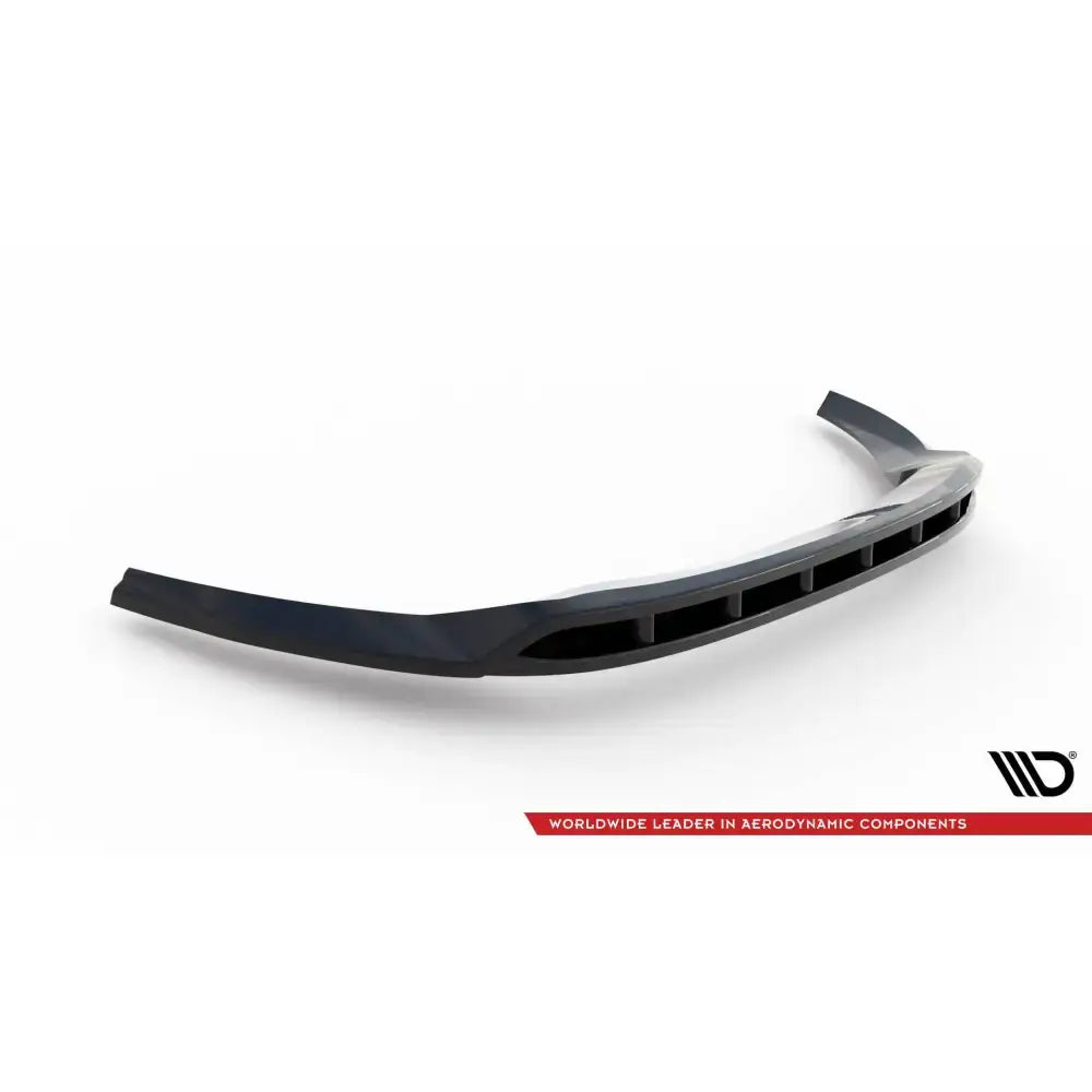Front splitter for Ford Transit Custom Mk1 i sort plast med vertikale åpninger, sett forfra på hvit bakgrunn.