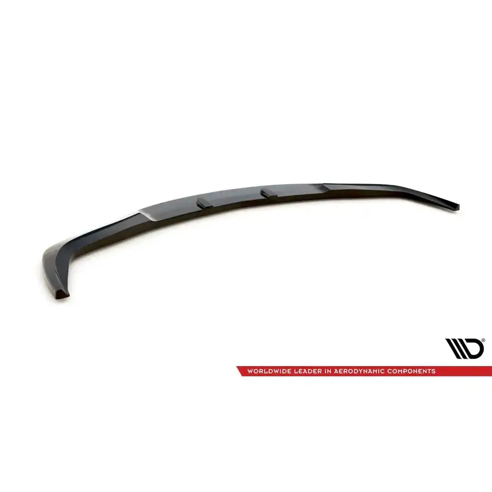 Frontspoiler til Infiniti G37 Coupe 09-13 i svart plast med markerte kanter, sett skrått ovenfra.