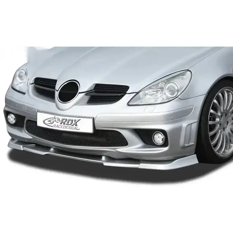 Frontspoiler Mercedes SLK R171 AMG sølvfarget montert, sett fra skrå front med luftinntak og tåkelys.