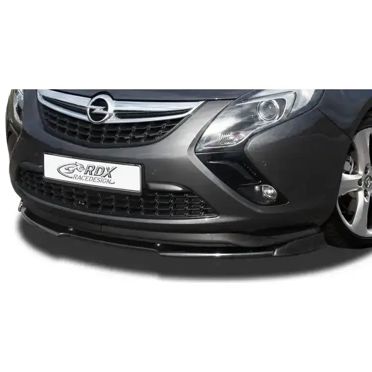Frontspoiler til Opel Zafira Tourer 11- i blank svart, montert foran på mørkegrå bil, skrå frontvinkel.