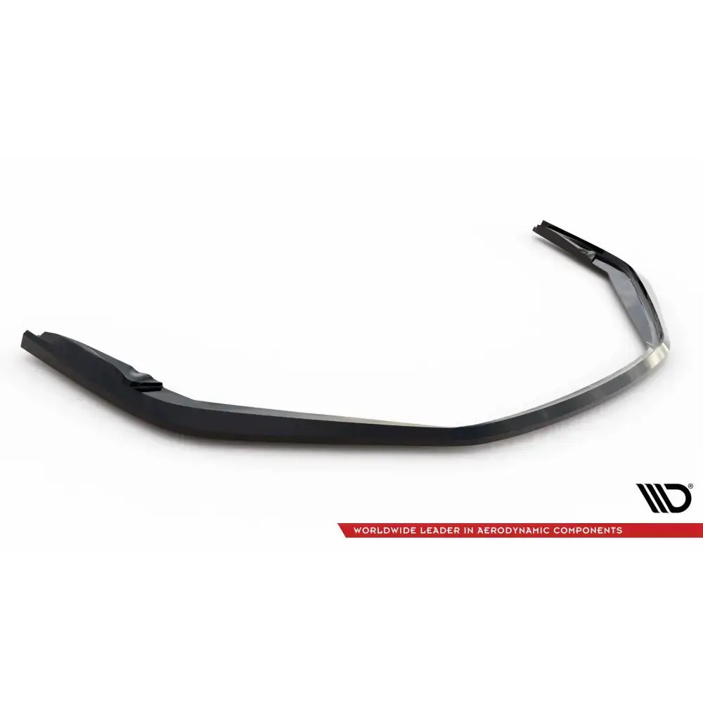 Front lip til Porsche 718 Cayman GT4 RS 982c, sort plast med vinklet design og hevet parti, sett skrått ovenfra.