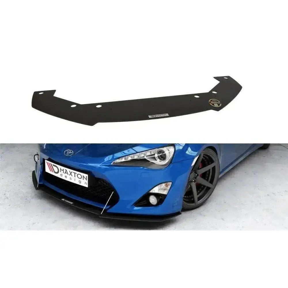 Frontspoiler til Toyota GT86 Racing V.1 i sort plast med monteringshull, vist montert på blå sportsbil.