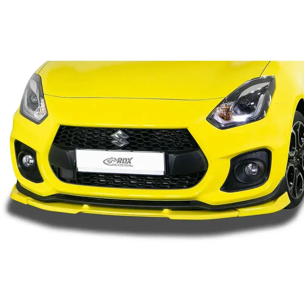 Frontspoiler Suzuki Swift Sport RZ/AZ 18- montert på gul bil med svart grill og tåkelys sett forfra.