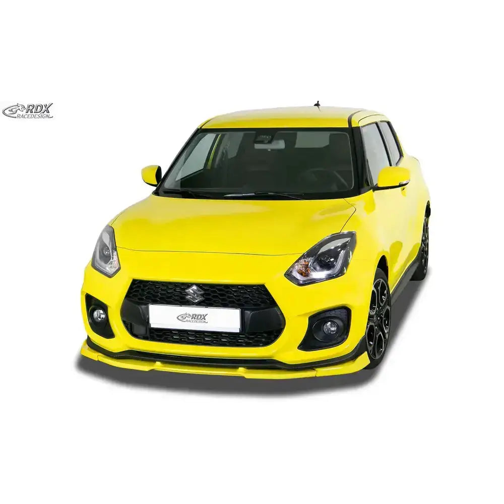 Frontleppe på Suzuki Swift Sport RZ/AZ 18- i gul med sorte detaljer, sett forfra mot hvit bakgrunn.