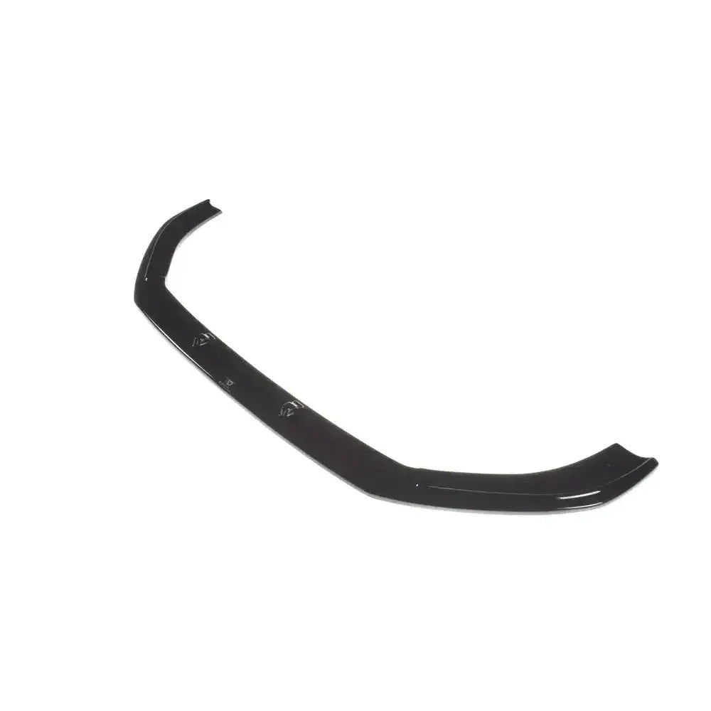 Frontspoiler Audi RS3 8V FL Sportback V.1 i sort, blank plast sett skrått ovenfra mot hvit bakgrunn.