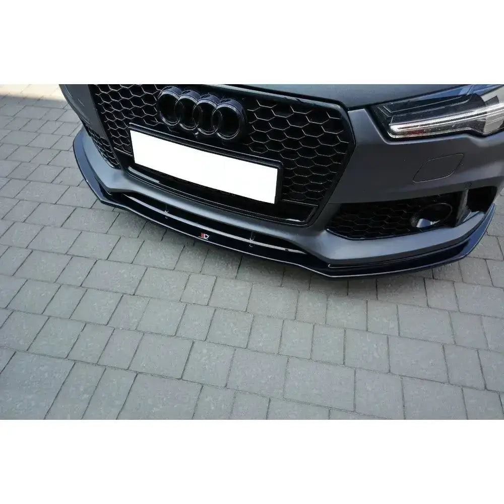 Frontleppe Audi RS7 Facelift V.1 sort plast montert under støtfanger, sett forfra med grill og lykter synlige.