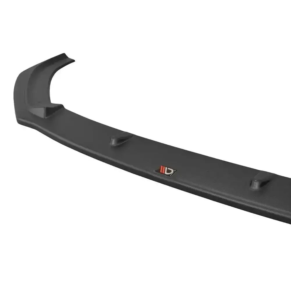 Front lip for Audi S3 / A3 S-Line 8V FL V.1 i sort matt plast med røde logodetaljer, sett skrått ovenfra.