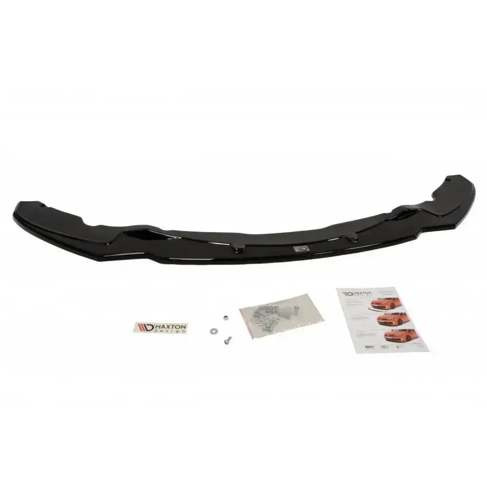 Front lip til BMW 4 F32 M-Pack V.1 i sort blank plast, sett ovenfra med skruer, bruksanvisning og logo.