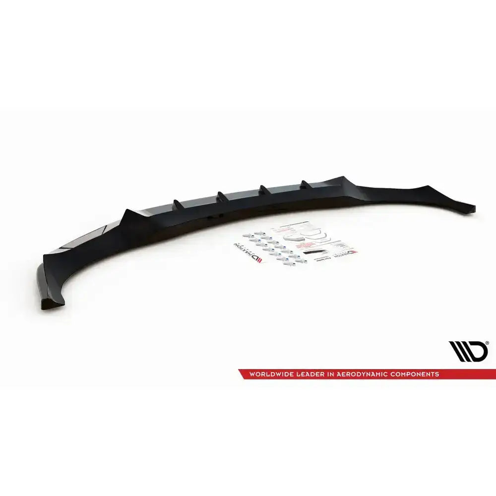 Frontspoiler BMW X6 M-Pack G06 sort plast med monteringskit og instruksjoner på hvit bakgrunn.