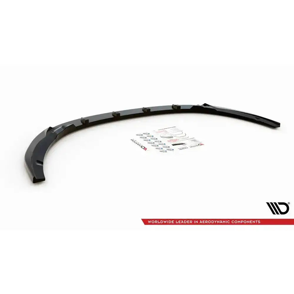 Frontspoiler til Kia Optima Mk4 V.1 sett ovenfra med festemateriell og instruksjoner på hvit bakgrunn.