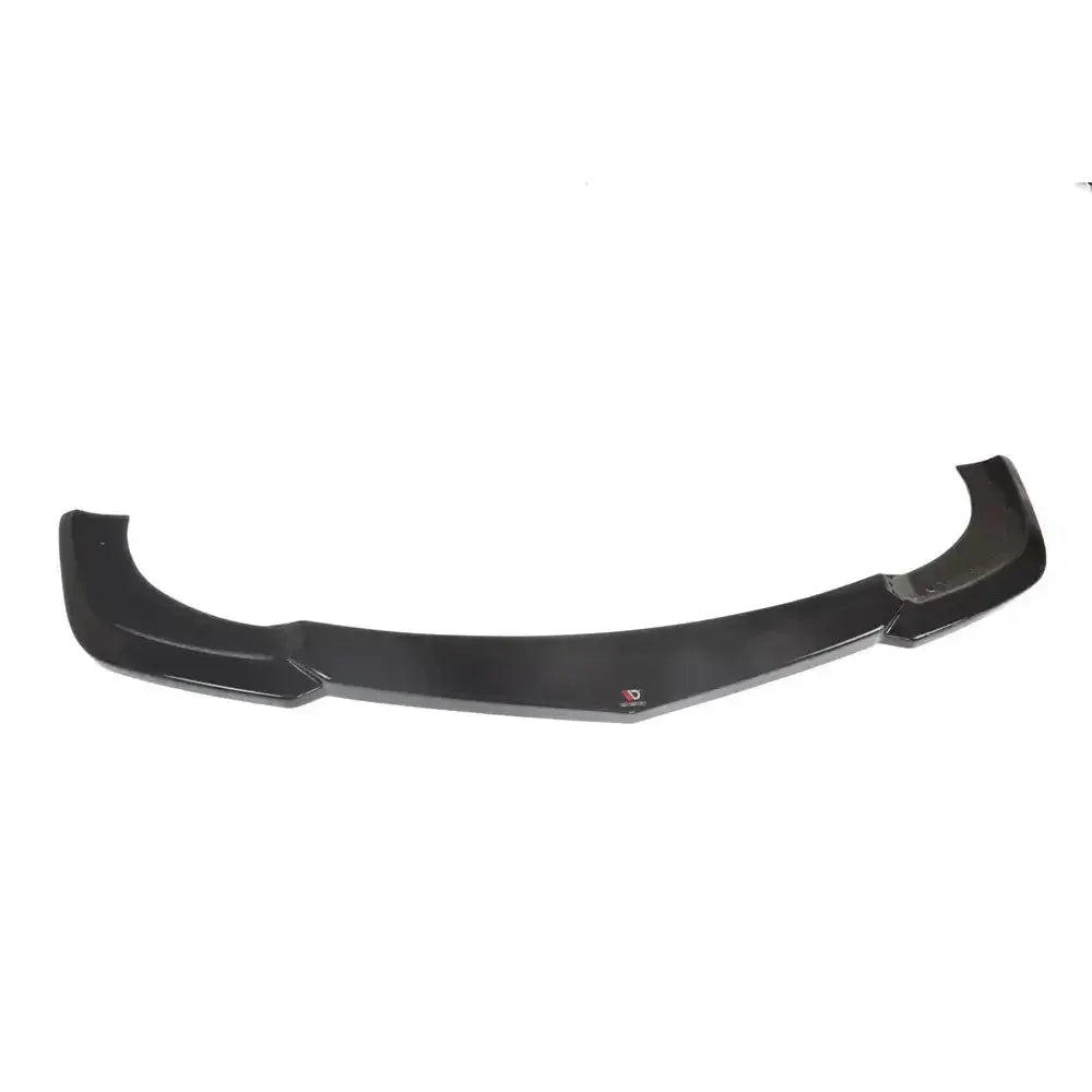 Front lip til Mercedes E-Klasse W207 Coupe AMG Line, svart buet spoiler sett ovenfra mot hvit bakgrunn.