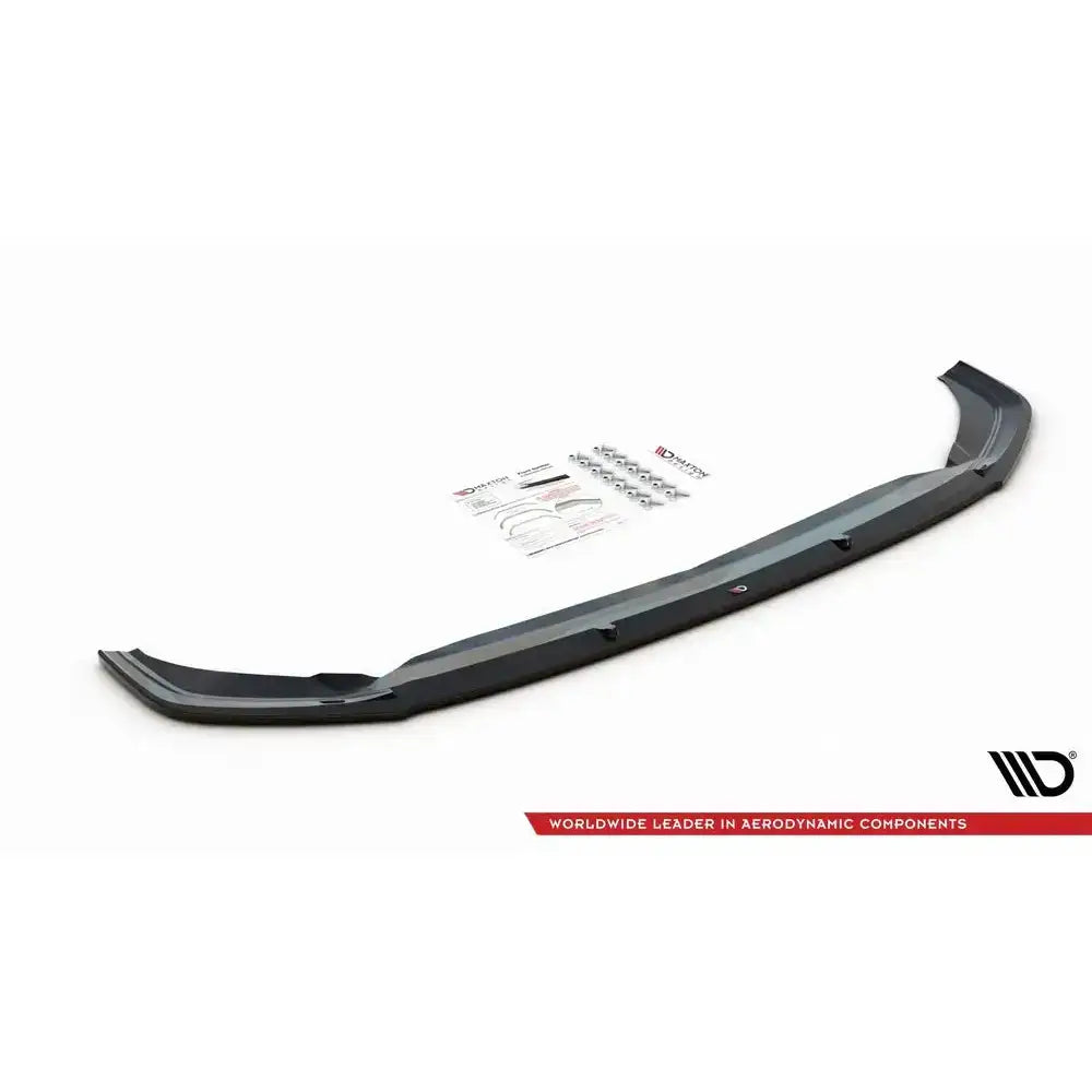 Frontspoiler VW Polo Mk6 GTI V.1 i svart plast med monteringsutstyr og instruksjoner, sett skrått ovenfra.