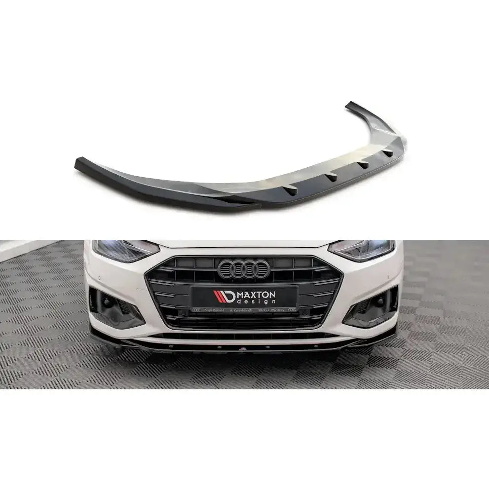 Frontspoiler Audi A4 B9 Facelift V.2 i sort glanset plast montert på hvit bil med aerodynamiske detaljer.