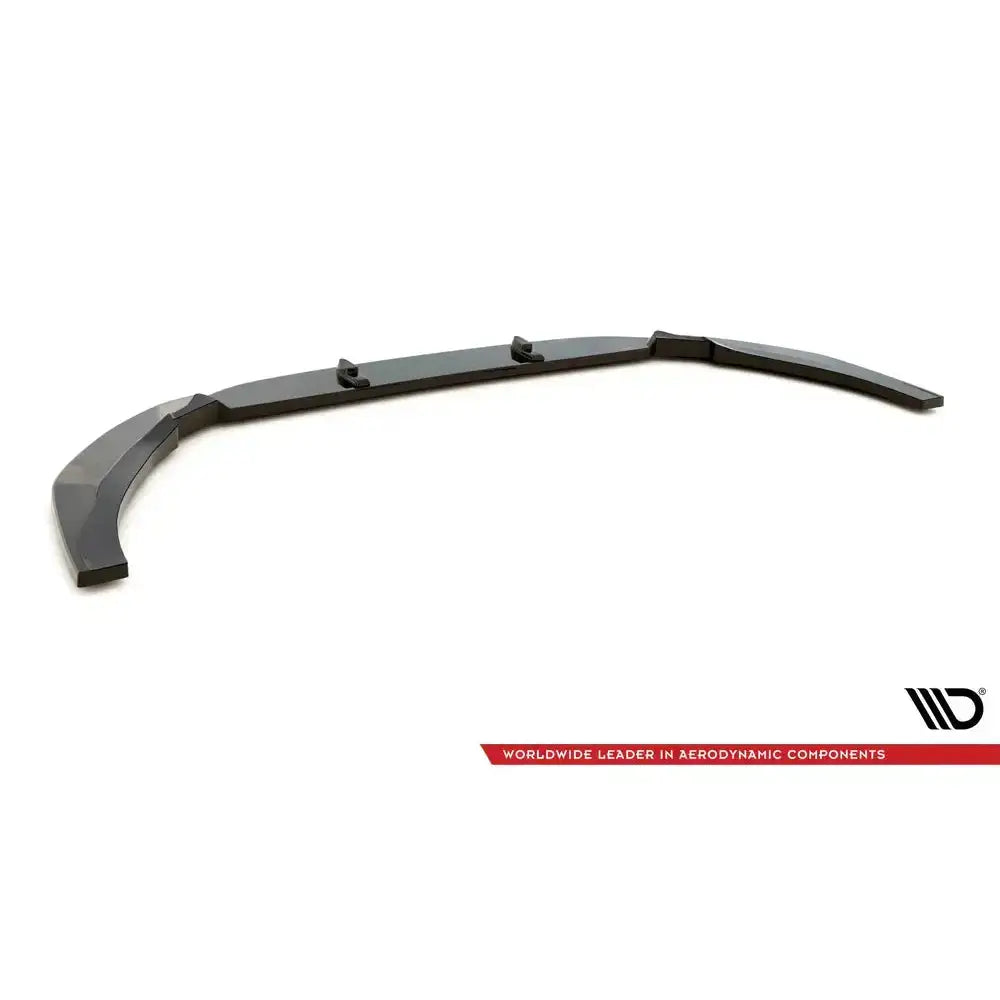 Frontspoiler Audi RS5 F5 Facelift V.2 i svart plast, skrå vinkel, synlige fester og buet form mot hvit bakgrunn.