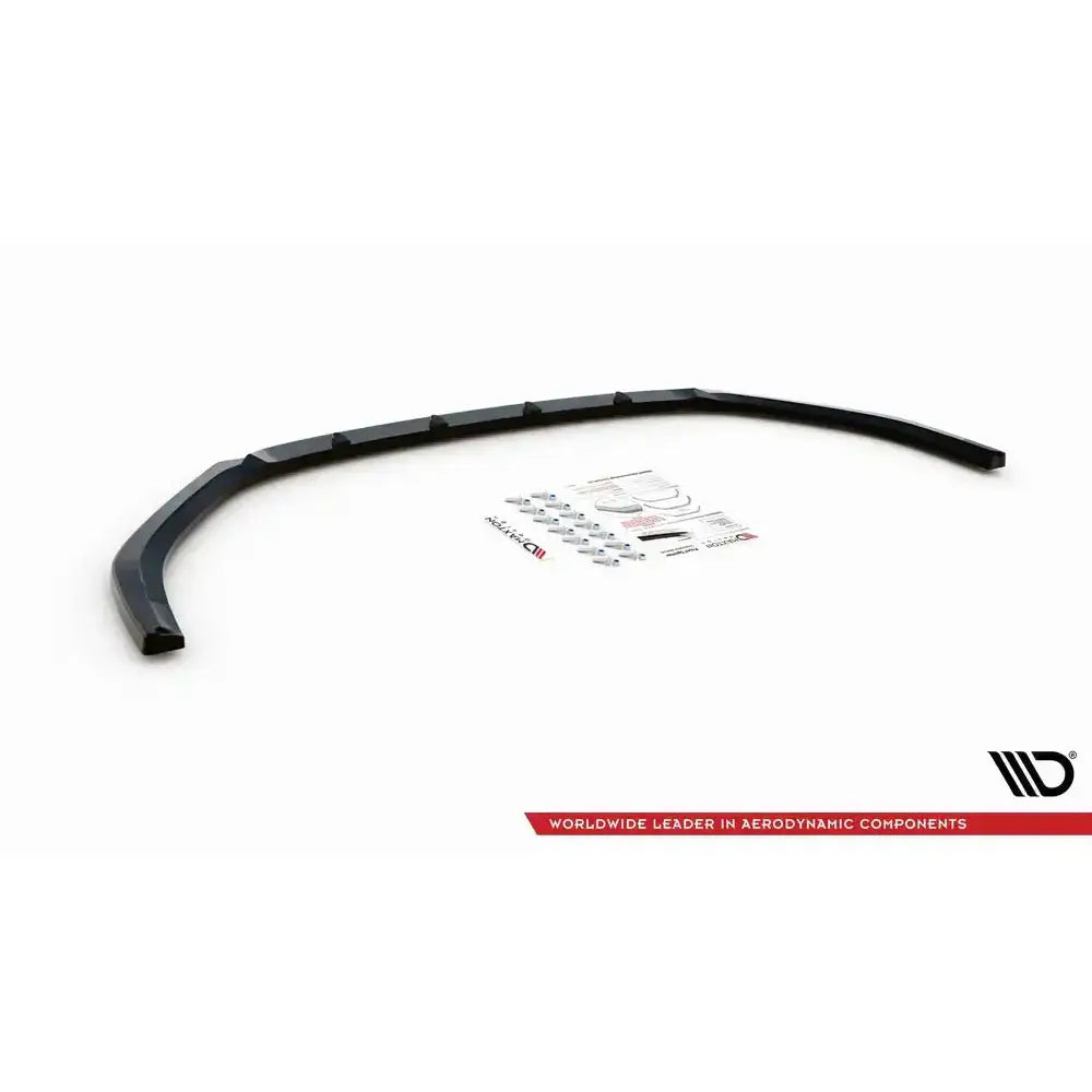 Front lip til Mazda CX-3 V.2 15-, sort plast med monteringssett og instruksjoner på hvit bakgrunn.